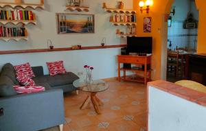a living room with a couch and a table at Silencio in Cala Ratjada