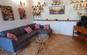 a living room with a couch and a glass table at Silencio in Cala Ratjada +16 photos
