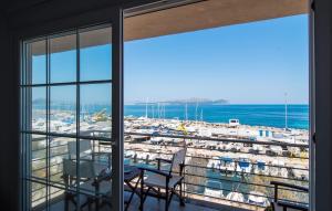 a view of a harbor from a room with windows at Minimal in Can Picafort