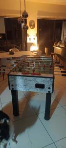 a chess board on a table in a room at La Velaysienne 5 étoiles piscine,sauna, jacuzzi in Le Monteil