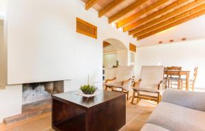 a living room with a couch and a fireplace at Pedra Viva in Son Servera