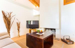 a living room with a couch and a fireplace at Pedra Viva in Son Servera