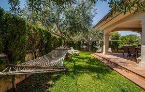 a hammock in the yard of a house at Calma De Son Serra De Marina in Son Serra de Marina