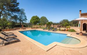 a swimming pool with lounge chairs around it at Es Campets in Sencelles +39 photos