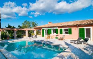 a villa with a swimming pool and a house at Santa Maria in Artá