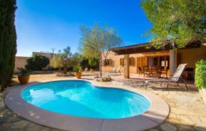 a swimming pool in the yard of a house at Sa Plana in Cala Bona +40 photos