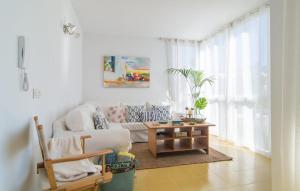 a living room with a couch and a coffee table at Mirella in Pollença