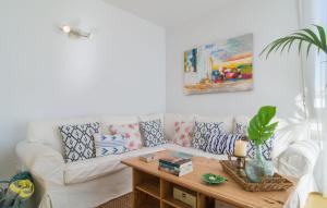 a living room with a white couch and a coffee table at Mirella in Pollença +24 photos