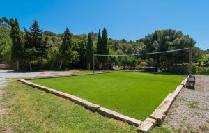 a soccer field with a net in a park at Son Favar in Capdepera