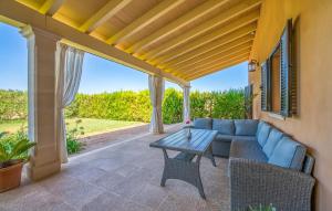 a patio with a couch and a table at S'hortet Gran in Alcudia +34 photos