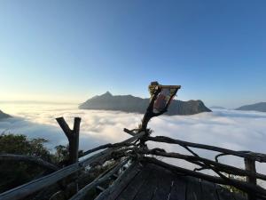 a view from the top of a mountain with clouds at Papae viewpoint with camping in Ban Ngoy-Nua