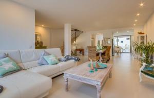 a living room with a white couch and a table at Foners Mallorquins in Muro