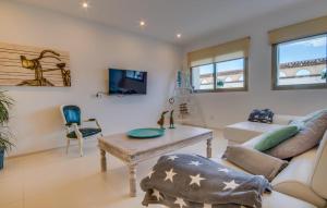 a living room with a couch and a table at Foners Mallorquins in Muro