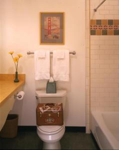 a bathroom with a toilet with a box on top of it at Sonoma Creek Inn in Sonoma