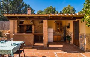 a patio with an outdoor kitchen in a house at Manrique in Cala Ratjada