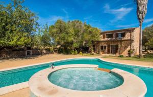 a swimming pool in front of a house at Mirabo Ramonet in Felanitx