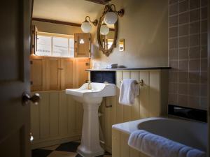 a bathroom with a sink and a bath tub at The Rookery in London +57 photos