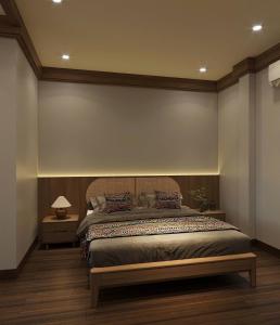 a bedroom with a large bed with a bench on it at Voi Meo Vac Hostel & Breakfast in Mèo Vạc