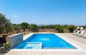 a swimming pool in the middle of a yard at Can Paxaco in Alcudia