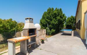 a stone oven with a bench next to a building at Can Paxaco in Alcudia +39 photos