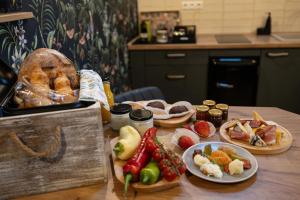 a table with different types of food on it at a Ficak in Miskolc