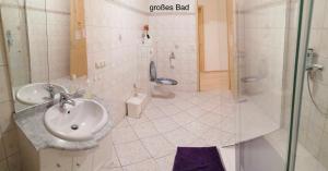 a bathroom with a sink and a toilet at Gaestehaus Remde in Erfurt