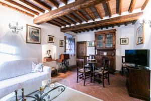 a living room with a couch and a table at Le Scope 5* in Villa