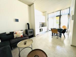 a living room with a couch and a table at Calliste's House in Ioulis