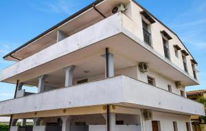 a large white building with a lot of windows at Awesome Apartment In Palmi in Palmi