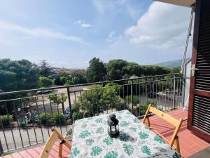 a table and chairs on a balcony with a view at Capoliveri Lecce Home in Capoliveri +5 photos