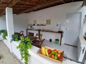 a bowl of fruit on a counter in a kitchen at Pousada Unidos in Jijoca de Jericoacoara