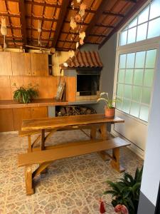 a kitchen with a table and an oven in a room at Casa Mary Bela's in Ponta do Sol