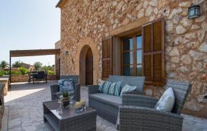 a patio with a couch and chairs and a table at Sa Finqueta in Manacor