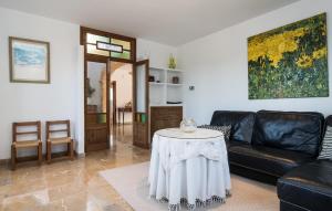 a living room with a couch and a table at Sa Finqueta in Manacor +19 photos