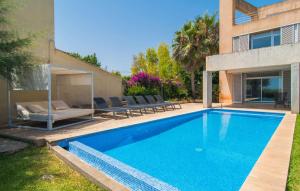 a swimming pool in the backyard of a house at Port Nou in Cala Bona