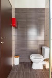 a bathroom with a white toilet in a room at Eca Apartments Atmabnb33 in Thessaloniki +25 photos
