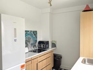 a kitchen with a counter top with a toaster oven at Seasgair in Dingwall