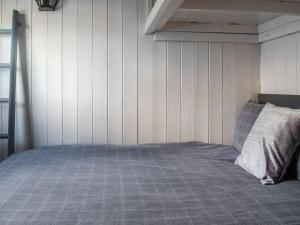a bed in a room with white walls at Shepherds Hut - Uk50043 in Chipping +6 photos