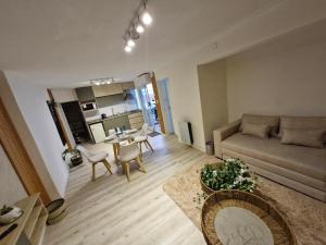 a living room with a couch and a table at Estudio Villa Rosas in Rafaela