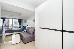 a living room with a couch and a table at Hua Hin Condo A - Maysa & Hin Nam in Hua Hin
