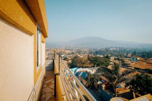 a view of a city from a balcony at Cityscape And Retreat Hotel in Mbeya