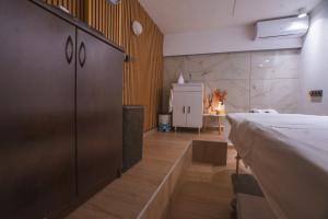 a room with a bed and a table in it at Alkyonis Hotel & Spa in Kato Loutraki +50 photos