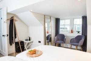 a room with a white table and chairs in a room at One Shore Street in Donaghadee +17 photos