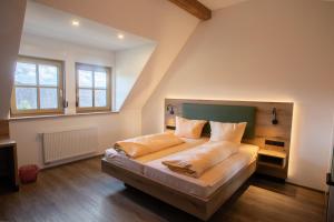 a bedroom with a large bed in a room at Gutshof Colmberg in Colmberg