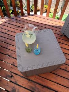 a vase and candles on a table on a deck at Rusibiki in Gqeberha +24 photos