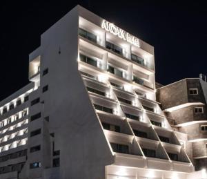 a building with a hotel sign on the side of it at סי סייד אילת חדר משפחתי מפנק עם נוף לים in Eilat