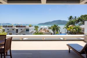 a view of the ocean from the balcony of a resort at Selina Serenity Rawai Phuket in Rawai Beach