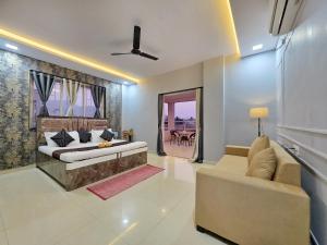 a living room with a couch and a table at ll EMPYREAN STAYS ll SUPREME VILLA II 3BHK II AC II PVT POOL II MINI BAR in Lonavala +49 photos