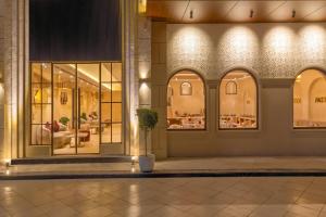 a store front with a potted plant in front of it at Sterling Saryu Ayodhya in Ayodhya +38 photos