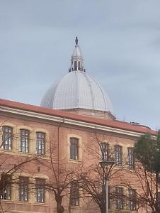 a building with a dome on top of it at Casa Di Leonardo in Loreto
